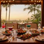 Table dressée pour un dîner gastronomique avec vue sur les palmiers au coucher du soleil au Majestic Mirage Costa.